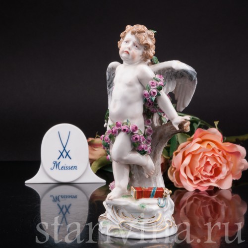 Антикварная фигурка из фарфора Купидон, связанный гирляндами из роз, Meissen, Германия, кон. 19 - нач. 20 вв.
