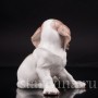 Статуэтка собаки из фарфора Сидящий щенок сенбернара, Nymphenburg, Германия, нач. 20 века.
