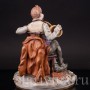 Фарфоровая статуэтка Любимый инструмент, мужчина с рожком Scheibe-Alsbach, Германия, сер. 20 века.