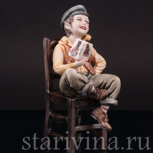 Фигурка из фарфора Мальчик с книжкой на стуле, Capodimonte, Италия, вт. пол. 20 в.